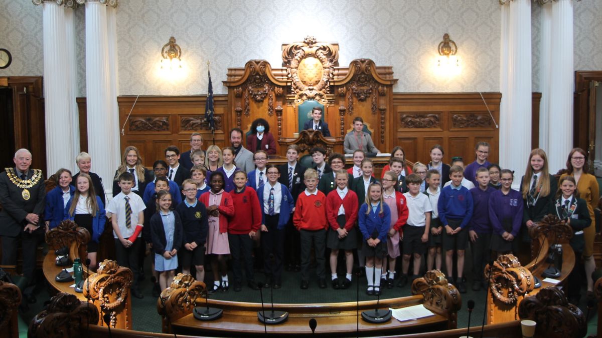 Group shot of Stockport pupils in the town hall