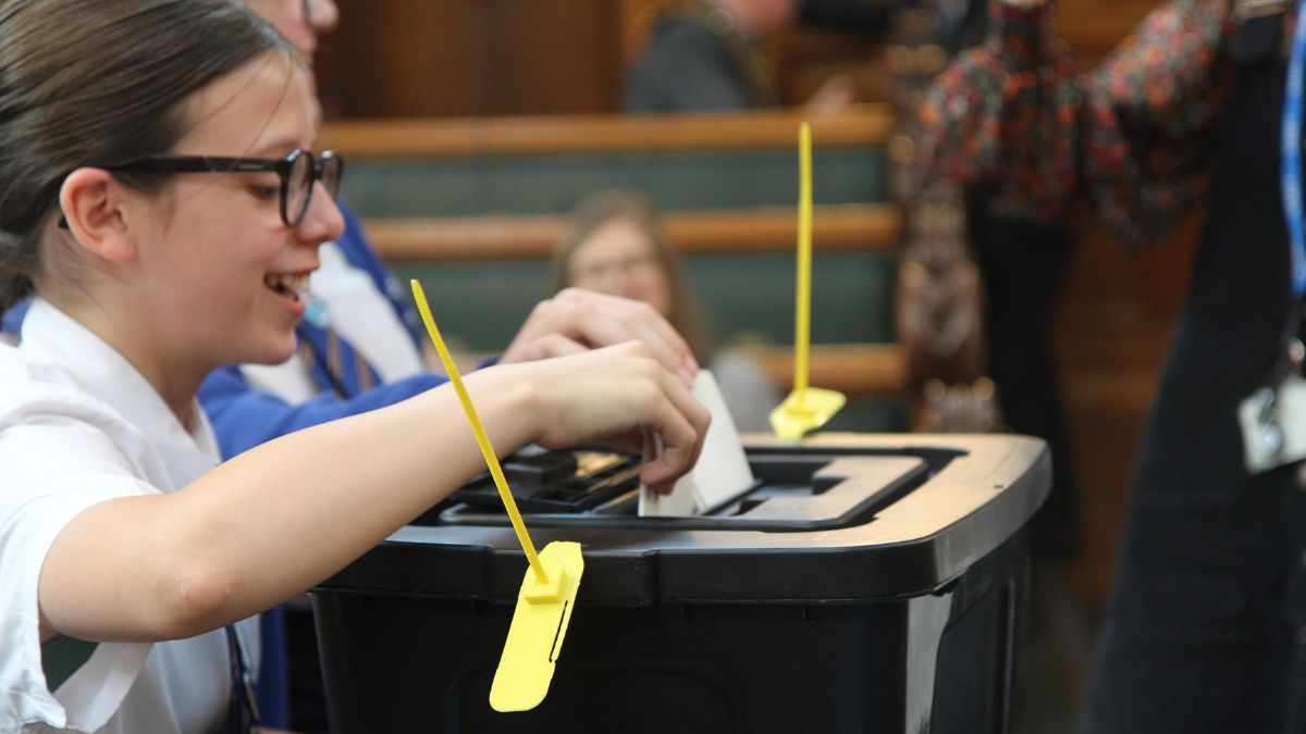 A Stockport pupil voting for the idea she wanted to prioritise for climate action