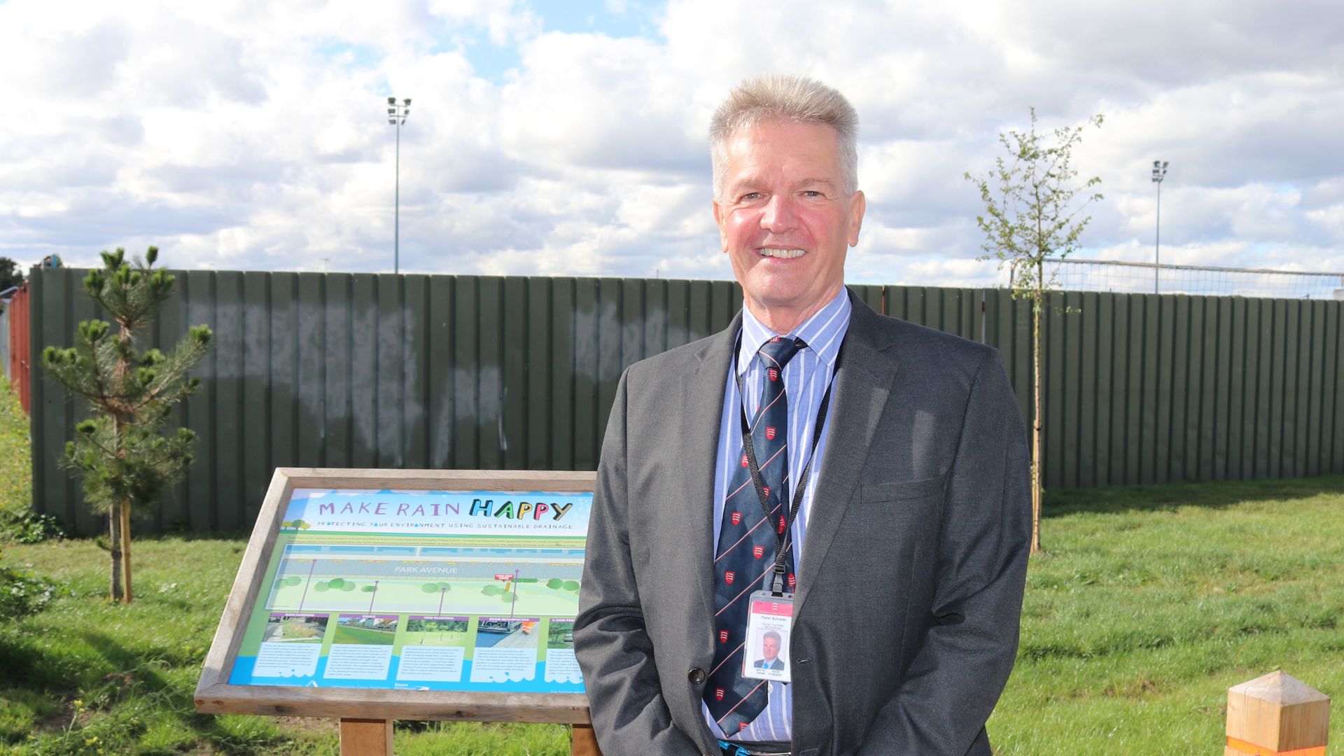 Cllr Peter Schwier standing in front of the scheme’s lectern board