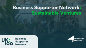 Business Supporter Network banner featuring 'Sustainable Ventures' text overlaid on a blurred background of people networking in a plant-filled office space. UK100 Business Supporter Network logo appears on the left, with Sustainable Ventures' white arrow logo on the right. Dark teal overlay with white and bright green text creates a professional, environmental aesthetic.