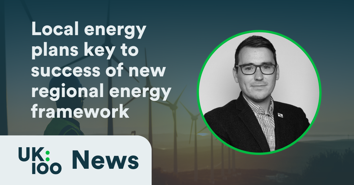 Image showing wind turbines in the background with text overlay reading 'Local energy plans key to success of new regional energy framework'. The UK100 News logo appears in the bottom left corner, and the right side features a circular portrait of a man in professional attire wearing glasses. The image relates to regional energy planning initiatives in the UK.